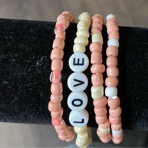 Bracelet set of four orange themed.